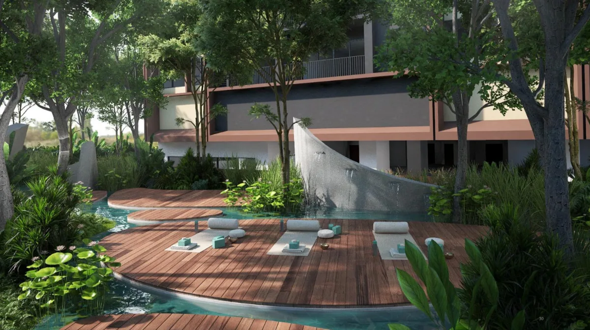 Timber deck over a lily pond with yoga mats and bolsters